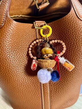 Cute doll sitting in the basket Charm Bag Keychain phone